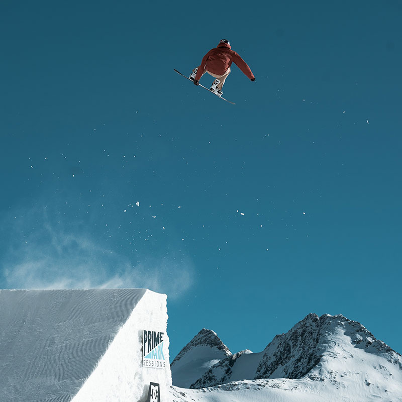 Snowboarder jumps over Ramp